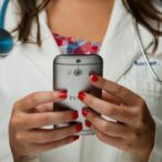doctor holding phone in hands